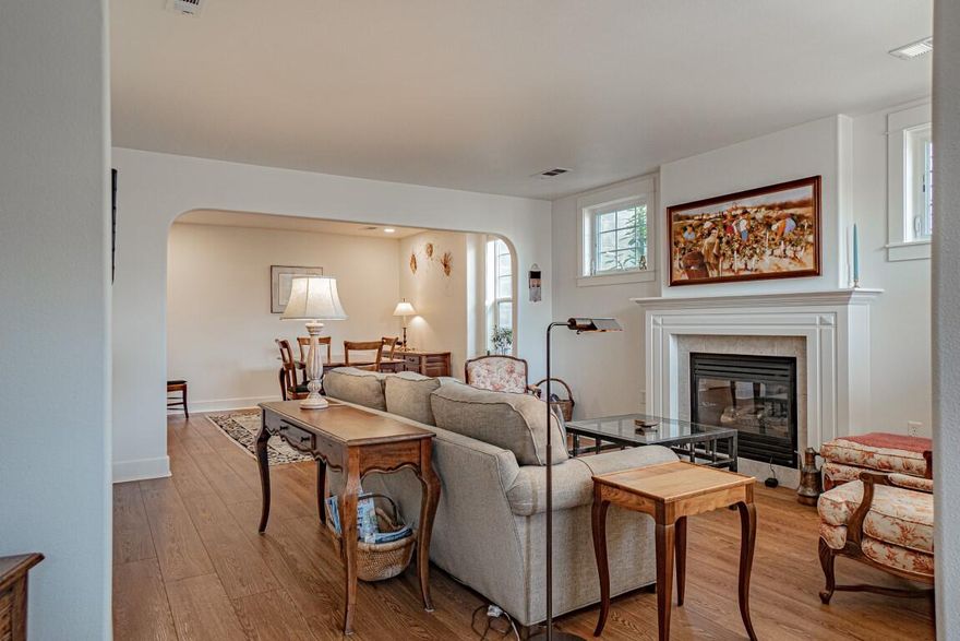 Lovely single-level condo in Ashland's premier 55+ Mountain Meadows community. This beautifully updated home features quality wood flooring, gas fireplace, open living/dining, and large sunny windows. The kitchen offers solid surface counters and abundant cabinetry. Enjoy a spacious guest room/office with en-suite bath and a charming primary suite with great storage, views, and private bath. Extras include built-ins, large laundry/utility room with sink, ample closets, and oversized single garage. HOA covers exterior maintenance, stunning landscaping, clubhouse, pool, fitness center, woodshop, trails, and gardens. Easy-care living in a serene, active setting!