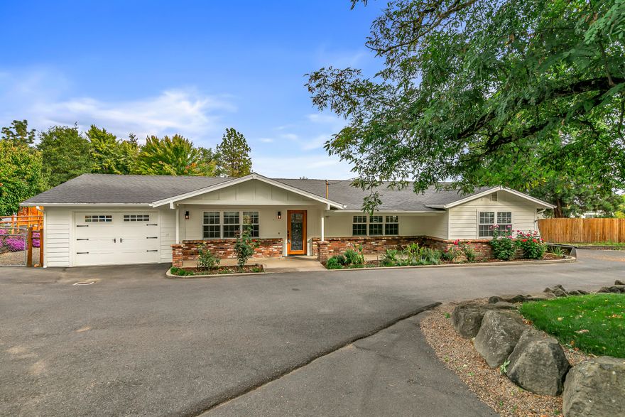 Check out this unique 3-bed, 2-bath home on 0.53 acre in rural Southern Oregon. This 1,876 sq ft gem boasts a new primary suite, split floor plan, and stunning oak floors. The island kitchen is a chef's delight and features a 5-burner gas stove, double ovens, granite counters, butcher block island, and walk-in pantry. The guest bath dazzles with Italian tile and granite. Enjoy a huge covered and enclosed patio, perfect for gatherings, plus a red brick patio with a BBQ hut. The expansive yard includes raised garden beds, a planting shed, and greenhouse. A 30'x35' metal shop with loft storage and adjacent RV carport adds versatility. Surrounded by hay pastures, this home offers a serene rural vibe. Upgrades include a 2025 septic system and heat pump. Just 10 minutes from town, this property blends modern comforts with countryside charm. Listed at $675,000, it's ideal for entertaining and rural living. Schedule a tour today!