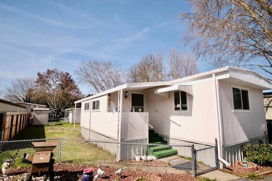 This two bedroom, two full bath home features a split floorplan, updated kitchen, ample size rooms, covered parking, and a 12x10 workshop. Residing in Country Estates  55+ park, amenities include private river access, RV/Boat storage, Pet friendly with restrictions. Home also includes washer/dryer, kitchen table, other furniture if desired.  Buyers must apply for approval by park management before making offer.