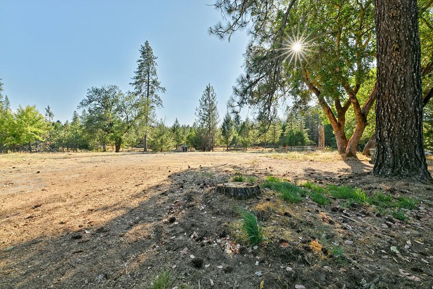 Build your dream home in one of the most desirable areas of East Evans Creek near Rogue River! This level 1-acre lot offers privacy, beauty, and convenience with a 16.5 GPM well, installed septic, and electricity at the street. A gated entry welcomes you to a peaceful setting surrounded by tall trees—perfect for gardens, animals, or simply enjoying the rural charm. Improved and ready to go, opportunities like this are rare! Just 8 miles to the City of Rogue River and I-5 access, and located in the sought-after community of Wimer, a popular suburb of Rogue River. Limited homes on the market—don't wait to bring your vision to life!