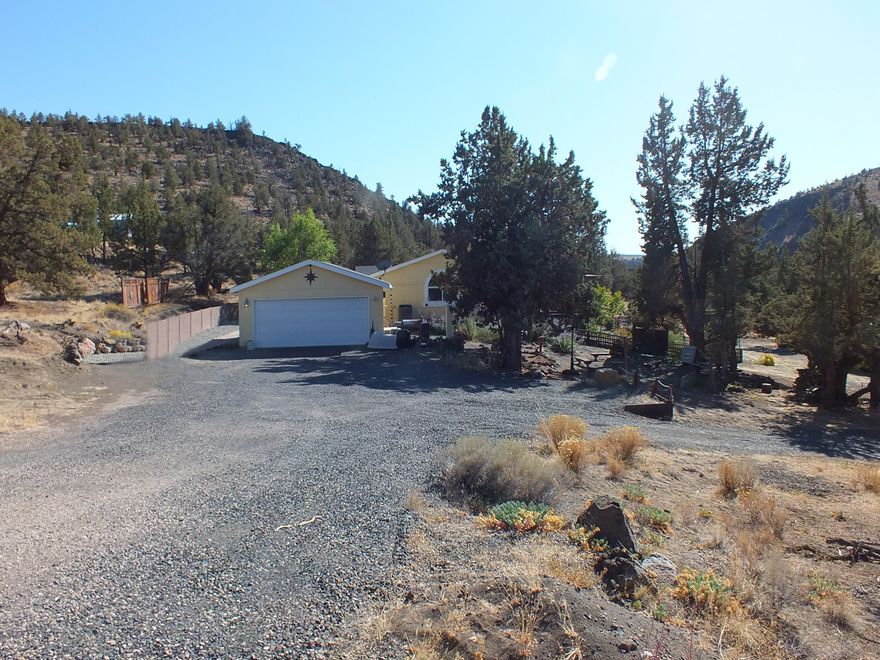 Looking for serenity? This property adjoins public land with equestrian trails near the canyon rim and it is steps to world famous fly fishing in
Deschutes river near beautiful Steelhead Falls. Home is very fresh and spacious with 10.5' coffered ceilings, expansive windows, open kitchen with a walk-in pantry & all
newer appliances. There is fresh paint throughout. Bedrooms are spacious with walk-in closets. Master bed is extra lg with a seating area & 2 walk-in closets. Master bath
has a serine soaking tub, shower & enclosed toilet. House is wired for a generator for emergency situations. There's a hot tub outside to relax in after a long day. The storage shed is insulated & makes a great workshop, studio,
etc. or garden in your greenhouse. Crooked River Ranch offers amenities such as golfing, tennis, disc golf, pickle ball, a swimming pool, miles of trails & the best fishing
around.