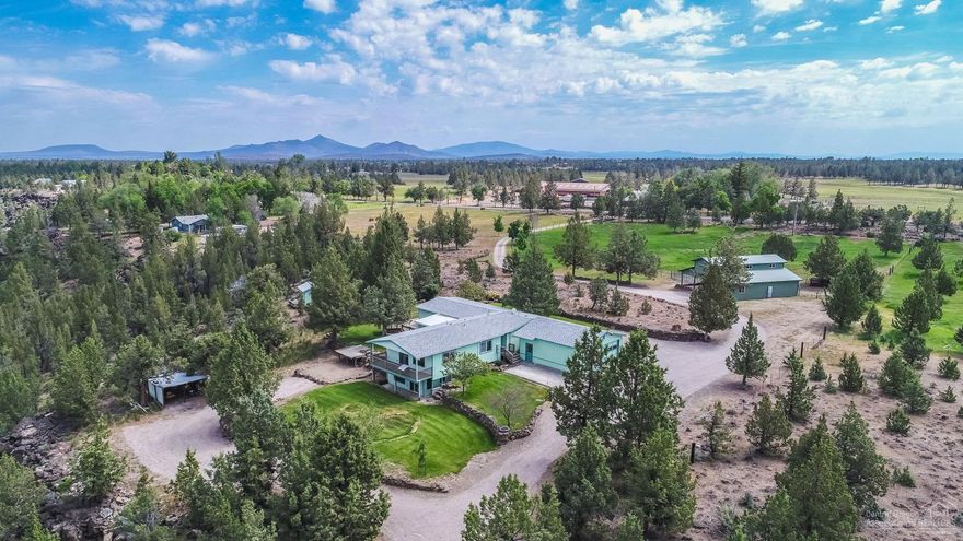 Desirable Cline Falls Premier Location! Private 4.73 acres w/ irrigation, only minutes to town. Bordering BLM & the Deschutes River. Mountain views, fenced pasture & trails to the river. A Central Oregon Dream! 40x60 pole barn with Shop Area, RV parking, underground utilities, plus a darling guest cabin. Lovely landscaped yard, perfect for outdoor entertaining.