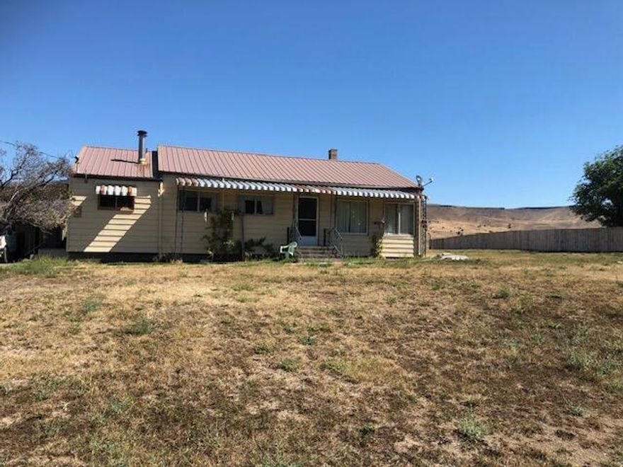 Room To Expand & Improve, Home In Dayville On 1.23 Acres w/Good Bones! Mt & river views, great potential just needs a few personal touches, been in the family for over 70 years, 1311 sq ft, 2 bedroom, bonus room, 1 bath, carport, large yard, irrigated, metal roof, plenty of room for a garage or shop, needing some TLC. $130,000 #1125