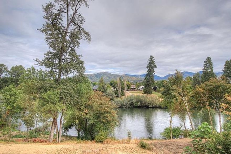 Pretty Rogue River View Lot at the end of a quiet street with no through traffic! This Property is Riverfront for all practical purposes, being one of the few Properties that directly adjoins the 1.37 Acre Common Area of this Exclusive Subdivision. Conveniently located just minutes to Downtown and in an Area of Fine Homes, this is the ONLY remaining available Lot in this fantastic Community. The Common Area is accessed via a well-built Concrete Stairway, and opens onto a wide-open expanse of Rogue River-front Property for your Recreational Enjoyment. Utilities are on-site and/or in the Street, so bring your Custom Home Plans to this Builder-Ready Parcel!
