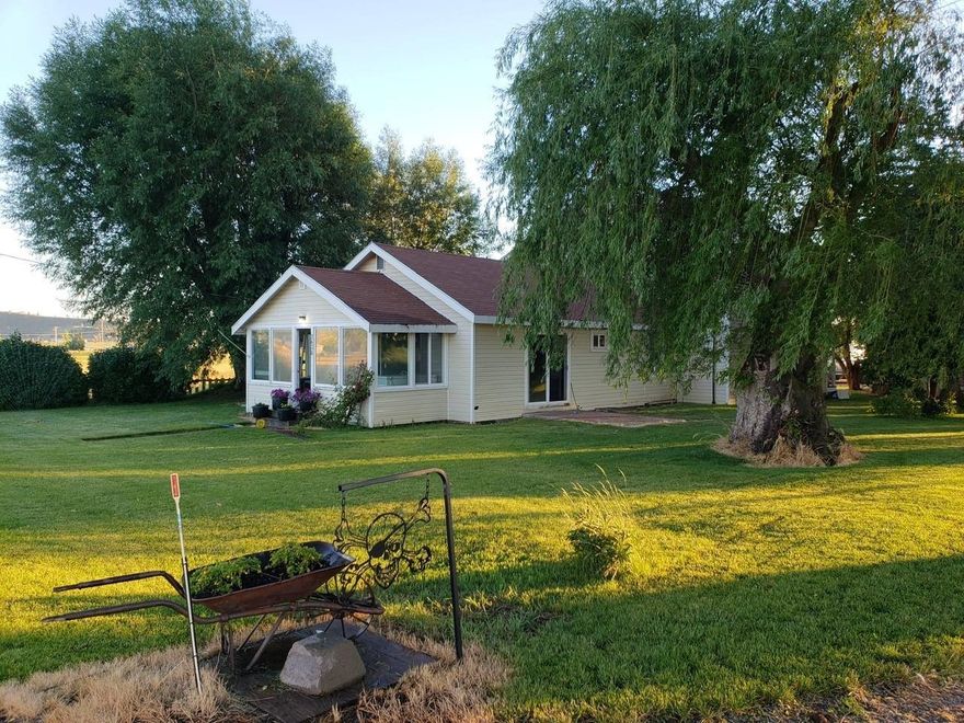 Nice home on one acre in Bonanza! Featuring 4 bedrooms, 2 bathrooms, family and living room with updated kitchen cabinets and counters. New forced air furnace about 2 years old and newer gas water heater, plus 18 new vinyl windows. Master is on the main level with large walk in closet, additional bedrooms are upstairs and all good size. Finished and enclosed front porch with large windows. Wood stove in the family room with a gas stove in the living room. Covered patio off the living with fenced in yard. Detached 2 car garage with workbenches and office space.Full price offers only!