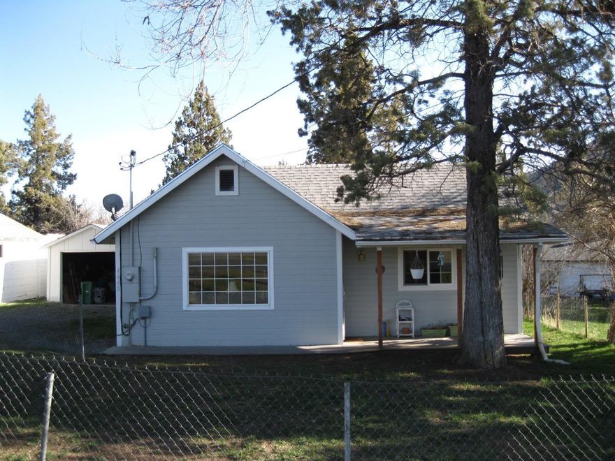 Super cute cottage on a large double lot! Home completely remodeled in 2012 from the foundation up! Remodel included new foundation, roof, siding, gutters, pex plumbing, all new electrical, interior sheet rock, new kitchen cabinets, granite counter tops with soapstone sink, flooring, tankless water heater, ventless gas heater plus electric heat for backup. Master bedroom includes an attached full bath with step-in shower. Stackable washer and dryer connections. Large lot features mature shade and fruit trees, detached one-car garage, separate storage building and plenty of room to build a shop! Home formerly on a private well, which still exists, but for convenience, owner connected home to city water when the home was rented. This home is a must see!