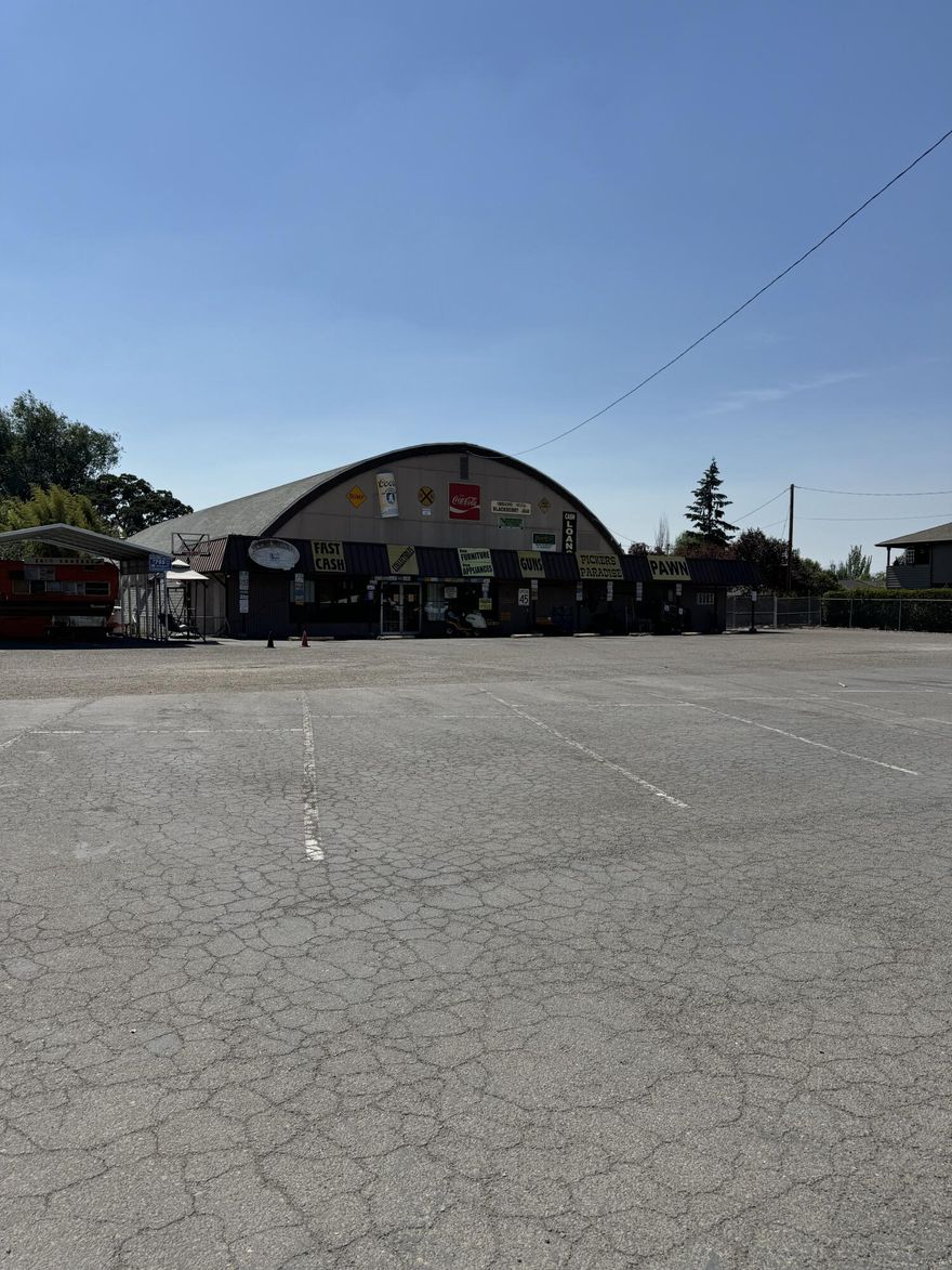 Commercial building on South Pacific Highway. Current tenant is Picker's Paradise with a one year lease, triple net, which equates to a 7.5% Cap Rate. Property is 1.76 acres and is zoned C-G so it's possible for commercial and/or apartment development. Apartments exist on the north side of property. The building is 11,008 square feet and in good condition.
Property is priced well as an investment and with all of the new development in Phoenix the price also makes sense for commercial land at $12/sf and multifamily land @ $20,000/unit.
