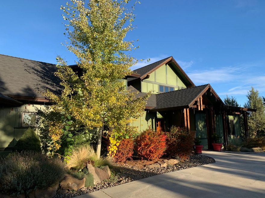 Enjoy amazing privacy and Full Cascade Mtn views on this acreage property in NW Bend. The single level home has three bedroom suites, an office and a fabulous big, open great room with huge windows to let the light in. Newly installed LVT flooring adds to the already high quality construction that you feel when you walk in the front door. The detached 3 car garage is accessed by a covered walkway from the home. The 4th bedroom/bathroom are in the bonus area above the garage, could be separate living quarters. Three irrigated acres from Swalley. Two are being used for the 1300 Lavendar plants and the landscaping around the home. The third is brand new and will be ready for the new owners to decide how they want to use it. There is a 1200 SF shop with power, a greenhouse, animal shelter and a heated chicken coop. The property is fully fenced and exceptionally private! All this and so much more, you need to see this rare gem!