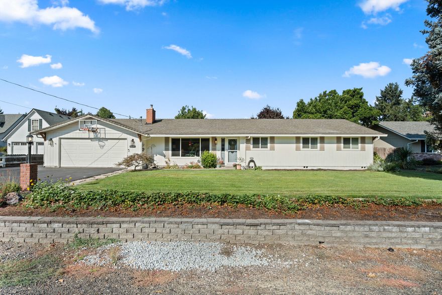 Rare find in a close-in location with city sewer and water! This beautifully remodeled home sits on a flat, usable half-acre lot with plenty of room for parking, toys, and outdoor living. Properties on this street don't come along often, making this a special opportunity.
Step inside to discover 4 bedrooms, two spacious living areas, and a light-filled interior with neutral tones throughout. The kitchen shines with butcher block counters, open shelving, and induction cooking—perfect for both everyday meals and entertaining.
Outside, enjoy landscaped grounds front and back, a dedicated garden area, covered boat storage, plenty of RV parking and a huge covered patio for year-round enjoyment.  Paid in full solar panels help reduce power bills adding even more value, An attached garage with extra storage completes the package. Conveniently located near schools, shopping, medical services, and the airport, this home blends city convenience with a peaceful rural feel.