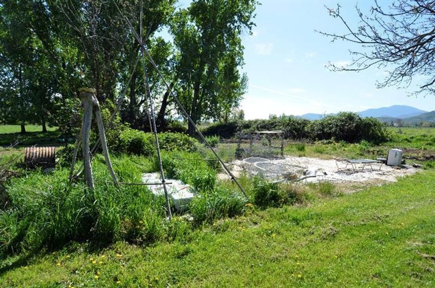 Irrigated farm land, yet close to town. Home was built in 1918, but has had some remodeling such as concrete foundation, newer roof, etc. Needs paint and TLC.