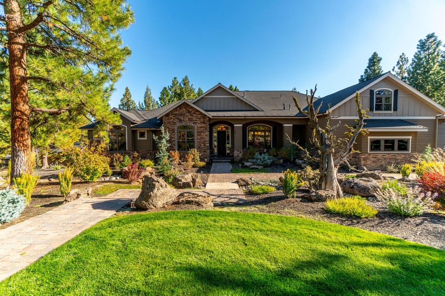 Perched on ten incredible acres overlooking Shevlin Park, this large and versatile custom home offers autonomy and serenity, yet is just minutes from west side Bend amenities and schools. Enter by way of a striking front circular drive and covered front porch to experience an inviting open living area with high ceilings and views of lush evergreen foliage from every window. The primary kitchen is ideal for entertaining with luxury appliances, beveled granite countertops, spacious Butler's pantry, formal dining, and breakfast room. With three main level ensuites, two additional bedrooms, a private office, and a full upstairs apartment, there is room for all. Enjoy the open daylight basement with game room, cinema, golf simulator, poker room, full kitchen, and access to a large back patio with nearly an acre of luscious green landscaping. The property is equipped with solar, propane, well, septic, a garden, chicken coop, boat bay, and direct access to Tumalo Creek & hiking trails.