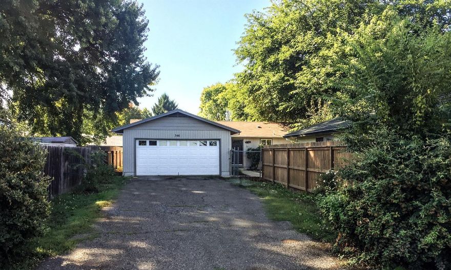 Complete remodel located back off the road on a large 0.33 of an acre lot nestled among massive trees. New flooring, new windows interior paint, new fixtures, new interior doors and closet doors, and a new glass slider door to access the new concrete patio. New bathroom vanities, and a modest second bathroom and closet added to the master bedroom. New heating system and air conditioner, and an entirely remodeled kitchen with new stainless steel dishwasher, microwave, and range/oven. Neutral and attractive selections throughout. Two car garage and a lengthy driveway. Don't delay, priced to sell and move-in ready. Bring your green thumb and make the yard beautiful. Broker owned, call your Broker for an easy appointment.