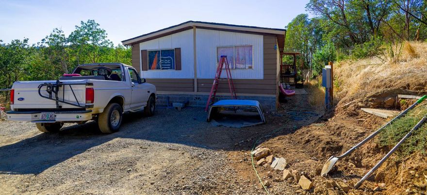 3bed 2bath twiced moved double wide manufactured home sitting on 3 acres.  Home was placed on a new pier block foundation in 2018 along with new HVAC system and new septic. Sale does not include lot split in process, removing approximately .79 acres on the north side of property. This lot split will make new lot size approximately 3 acres.