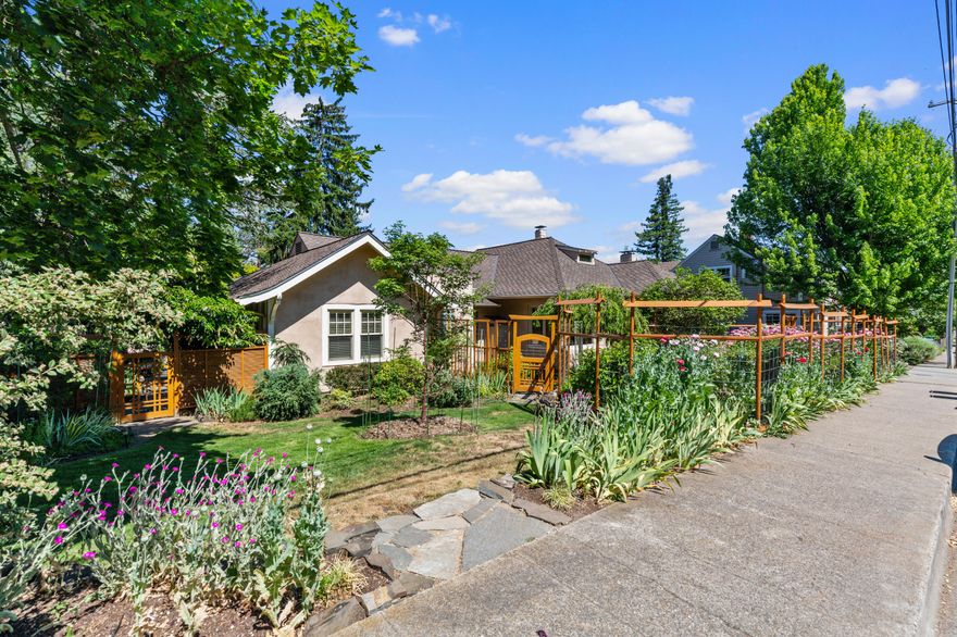 This stucco and stone, historic home is an excellently maintained private, spacious oasis featuring almost 2,900 square feet of living space and a fantastic, detached Studio and decks.  The property is nearly 1/3 acre of lush, mature landscape creating a welcoming and private, serene environment to entertain guests or enjoy morning coffee.  The home features three bedrooms, three bathrooms, a bright and airy living room with a fireplace, an updated galley kitchen, light-filled sunroom and a finished attic that can be an additional bedroom, playroom or office space.  Additional highlights include solar panels, a hybrid electric/fuel system, spacious basement, carriage house, carport with storage, transferrable Home Warranty and property is zoned R-2 (multi-family residential).  The Plaza is just three blocks away which is highlighted by shopping, dining, Lithia Park and all the charming qualities Ashland and the Rogue Valley have to offer.