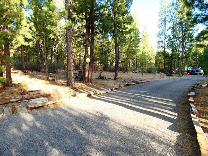 Great Partial Improved Lot in Sprague River Pines Community is ready for your home or RV. Per seller, electric& junction box on property prepared for heavy electric load. Dish TV equipment already on property. Has gravel driveway with culvert and property has been partially cleared. Shed/well house on property. An enclosed cedar fence (approx 20x30) is ready for your gardening & privacy needs. County road is privately maintained by neighborhood. Community has river access for Sprage River Pines members. A 5th wheel is currently on the property and can either stay as personal property with sale of land or can be removed upon request. All other personal property will be removed from land prior to closing. Look for small orange flags at base of driveway and RV on land. Sellers has done a lot of work on the property and ready for new owners to take the property to the next level! Buyer due diligence on fence size & river access.
