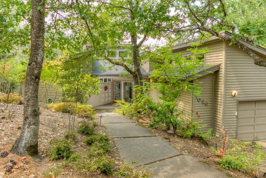 Contemporary and sophisticated home in a glorious, tree house setting. Ideal for the professional or artist to unwind, create and entertain. Walls of windows and great natural light. Expansive deck and gorgeous views of the mountains and across the valley. Open and inviting kitchen with granite, stainless, beverage center and more. Glorious master suites on each level plus an expansive office looking out the wall of windows. Incredible storage throughout and a sought after, above the boulevard location. Expansive decks on each level make this an incredible home for outdoor entertaining. Versatile separate of space make this home desirable to many. Don't miss your opportunity to own this immaculate Ashland home.