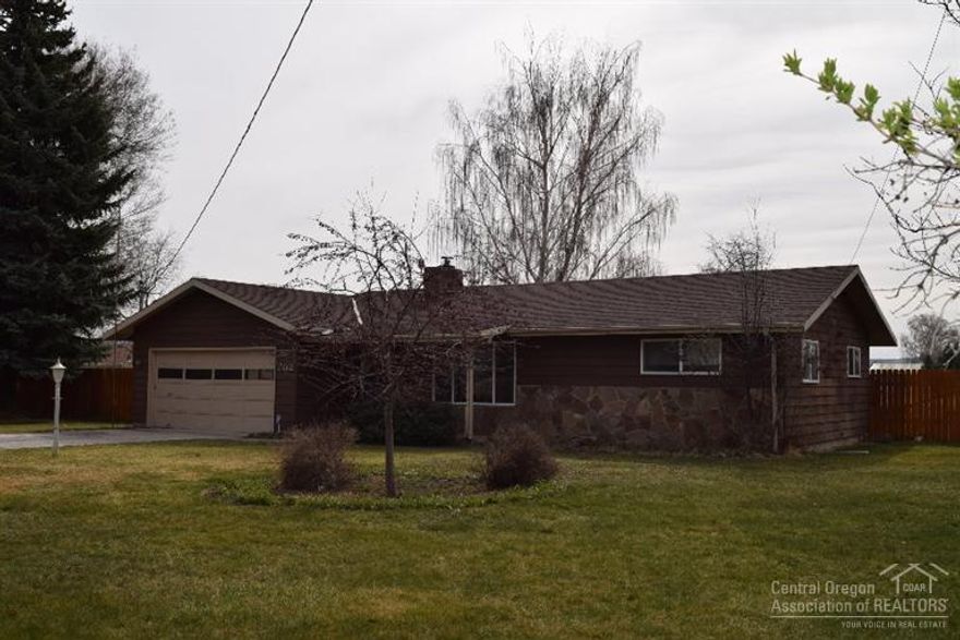 Country living at it's Best, 1 acre 7/10th irrigated with OID, 2 bedroom, 1 bath, attached 2 car garage, nice patio in a great location. Updates include pump on well. Great large storage shed, Metal Pole Barn, Pie Cherry and Apple trees along with nice landscaping including roses and lilacs. Riding Lawn Mower is an added bonus.