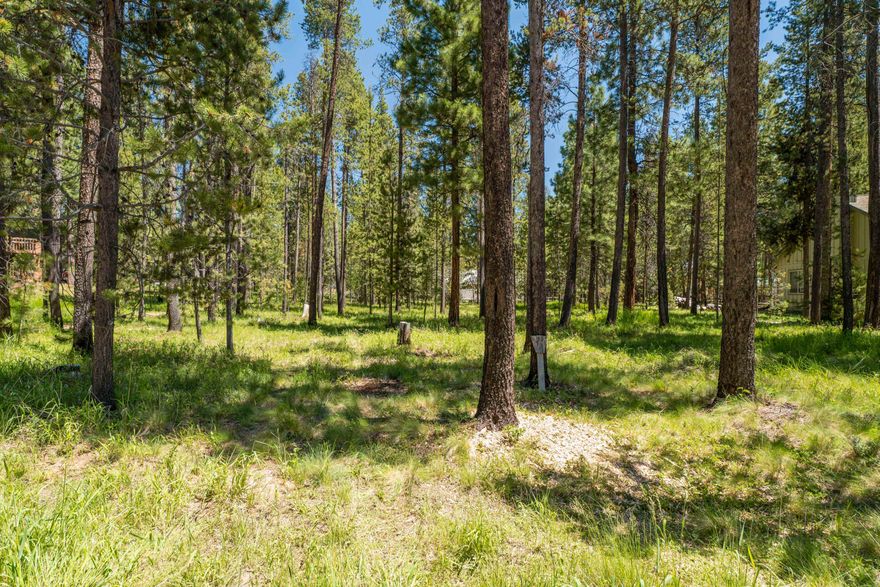 Don't miss this flat, beautifully treed homesite backing to common area on both sides, offering privacy and a peaceful setting in the highly desirable River Meadows community with utilities already at the street—including community sewer and water—this is the ideal location to bring your dream home to life. River Meadows is one of Central Oregon's best-kept secrets, perfectly positioned just 25 minutes from Bend, 20 minutes to Mt. Bachelor, and close to countless lakes, trails, and the national forest.