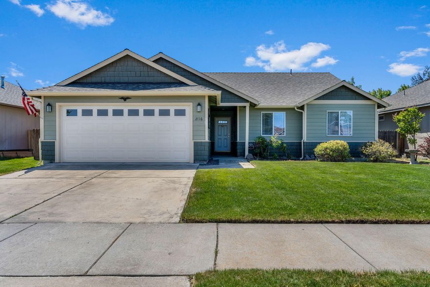 Charming single-level home in NW Redmond! This well maintained 3-bedroom, 2-bathroom home offers 1,448 sq. ft. of comfortable living space with a desirable open floor plan. Enjoy vaulted ceilings and a spacious great room that flows seamlessly into the kitchen featuring ample counter space, generous storage, and all appliances including the refrigerator. The primary suite includes a walk-in closet and nice separation from the additional bedrooms for added privacy. Modern features include central A/C, a tankless water heater, and a two-car garage. The fully fenced backyard with a patio provides the perfect setting for outdoor dining and entertaining. Conveniently located in NW Redmond, close to schools, parks, and shopping.