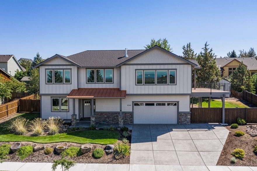 Stunning Mountain Views are waiting for you! Come, relax on your oversized, elevated deck that was built for entertainment and captures all of the cascades and will take your breath away. This 4 Bedroom 2.5 bath, reversed living is one you will not want to miss! Custom finished throughout with Hardwood floors, custom cabinetry, solid Granite countertops, floor-ceiling stacked stone fireplace, custom blinds over cased windows, custom tile walk in shower, built in speakers, gourmet kitchen with custom hood and soft close cabinets with an oversized island and so much more! In the fully fenced backyard you will find a spacious yard, custom shed for storage and a covered RV/Boat parking area behind a heavy duty custom gate for easy pull in-pull out. This home was built with pride and it shows! This is a truly Must See!