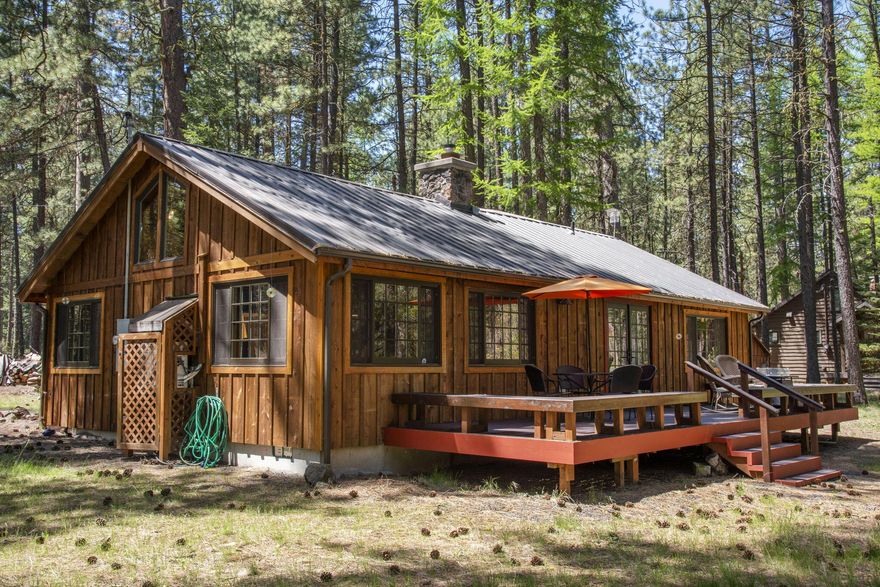 Discover your dream retreat on the Metolius River in Camp Sherman, OR! Recreational opportunities abound right out your door. This stunning 2-bedrm (sleeps 7), 2-bathrm home spans 1510 SF & boasts an array of modern updates.  Enjoy breathtaking views of the river, a world class Fly Fishing site, from your new deck—a perfect spot for morning coffee or evening gatherings. The inviting interior features new appliances, elegant tile, & gorgeous engineered oak flooring, providing a blend of comfort & style. A cozy fireplace & radiant floors in both bathrooms & area by French doors to the deck ensure warmth throughout the seasons. Benefiting from new plumbing & electrical system, Lennox ductless heat pump, as well as all-new lighting fixtures, this home is move-in ready. Situated on Forest Service permit land, it offers a unique blend of nature & privacy. Additional features include a detached 1-car garage, storage shed, & a welcoming covered porch. Make this exquisite property your own.