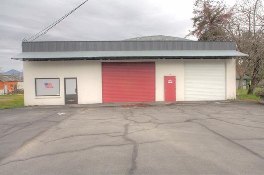 This hard to find commercial shop, is located on Hwy 99 near the new Fern Valley intersection in Phoenix. The building has 3 separate areas with 14 foot ceilings and has been freshly painted inside and all new LED lighting installed. The building is equipped with 3 Phase power, gas heat, and 5 overhead doors. Also includes 2 offices, bathroom and utility room. There's plenty of paved parking out front and double sided lighted signage. There's also a large fenced lot in back for an abundance of storage and extra parking. Lease is Modified Gross and includes taxes, insurance, water and sewer. Owner prefers a 1-3 year lease.