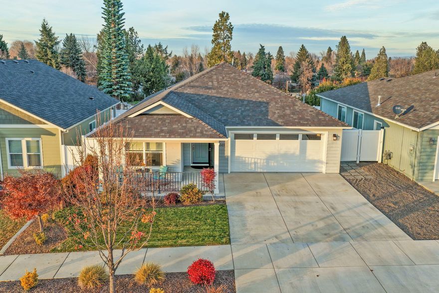 Open House Sat 01/10 1:00-3:00! Be a part of Nobility Village, a beautiful newer community perched on a knoll-top with quick access to I-5, downtown Medford, shopping, schools, and medical facilities.

This like-new, single-level 3-bedroom, 2-bath home is move-in ready and designed for comfort and style. Step inside to a spacious primary suite featuring a walk-in closet, double vanity, private water closet and walk-in shower.
The sun-drenched great room showcases coffered ceilings and premium 6-inch plank flooring that flows seamlessly into the kitchen. The spacious kitchen offers custom cabinetry, granite countertops, upgraded stainless steel appliances, and a convenient eat-in bar-perfect for perfect for both everyday living and entertaining.
Additional highlights include a custom laundry room with abundant storage, a generous guest bath, and front and back covered porches with a back deck ideal for outdoor relaxation or year-round enjoyment.