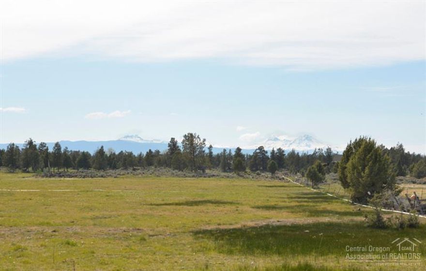 Much Sought After Cascade Mountain Views! This is a terrific country style home in a very private and quiet setting. The kitchen features roll out shelves (including pantry) and all the appliances are higher-end, SS. Vaulted living area has large windows to admire the view. Spacious master suite (separated from other two bedrooms), is tiled, with jetted tub, and tiled walk in shower. There is also an attached three door, finished, 3-car garage, and lots of parking for RV's!!!