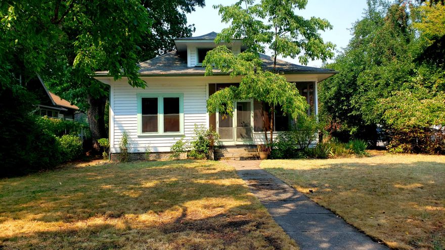 Historical charmer with many features only found in vintage homes! Built in 1905 this 2 br 1 ba home is on a .31 acre lot right in downtown Eagle Point.  Detached shop with loft. Potential to add ADU. Original oak hardwood floors, original trim and hardware, leaded glass windows and more. Basement for storage.  New insulation in the attic, gas furnace, updated electrical and plumbing.  Potential for commercial use or additional dwelling with the Historical District Zoning. Buyer to do diligence on approved uses.  Located across from the historical Butte Creek Flour Mill.  Property sold cash / as is.   Attention investors!  Potential to add an ADU!