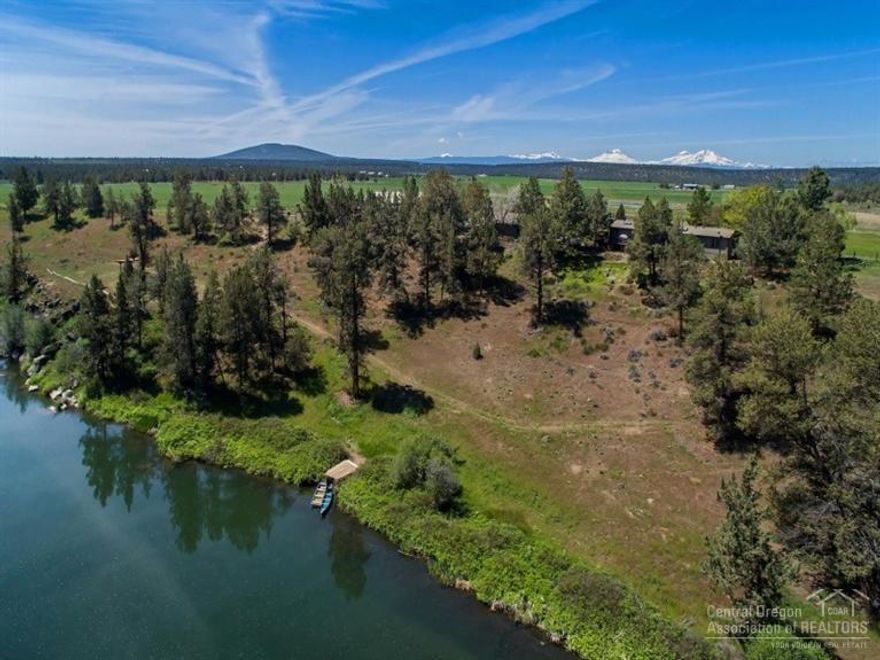 Beautiful, Private Setting overlooking the Deschutes River with stunning Cascade Mountain Views from 2022 SF single level home with custom finishes throughout and an open floor plan, 3 car garage with office. Property is 50 acres with easily accessible river bank for recreational activities. Barn- 80x60 with 7 stalls, tack room, shop area & 6 paddocks with auto waters.