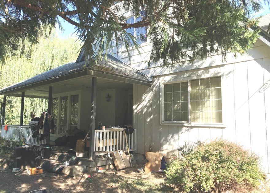 Older farm house near Historic Mill Creek Falls. Flat land with tons of potential! Outbuildings, barn, shops, carport. Home features family and living room with fireplaces, one bedroom downstairs and 2 upstairs.