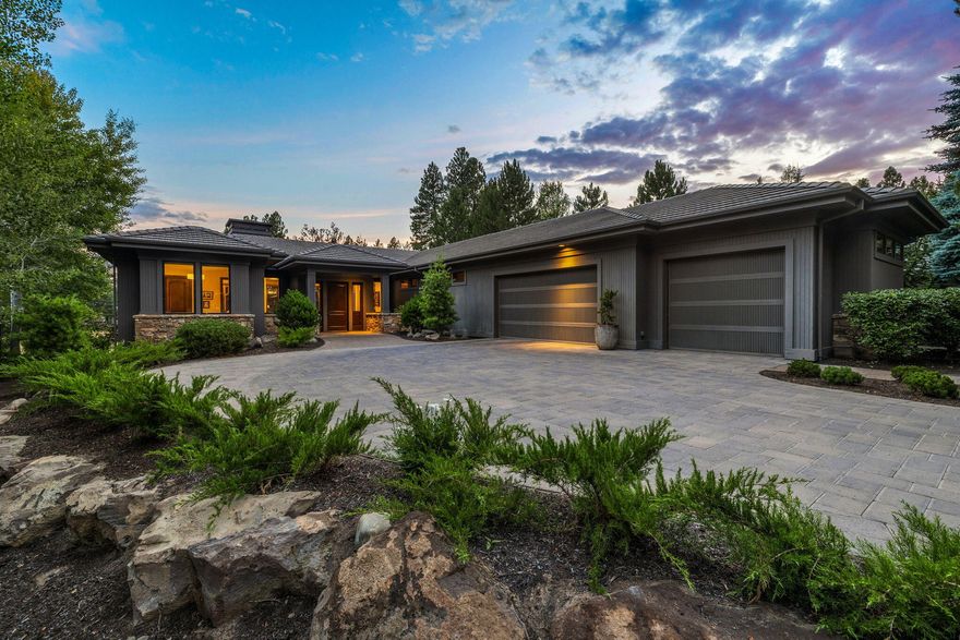 Pristine, newly updated, single level Broken Top home takes in sweeping views of the 17th fairway and glistening pond. This elegant home offers a flowing layout, designed for entertaining and an ideal separation of living spaces. Welcoming foyer opens to spacious great room, w/ windows framing the views and providing the perfect fusion of sophistication and warm ambiance with its Montana mossy rock wall encompassing the fireplace, wood flooring, custom lighting, fresh paint & clean lines. Kitchen features updated SS Dacor fridge, oven, microwave, Wolf cooktop, island, brkfst bar, desk & pantry. Beautiful dining area is cozy, yet spacious enough for hosting gatherings. Tranquil primary suite overlooks the views & provides a peaceful retreat for relaxing in front of the fire. Separate secondary primary suite provides well-appointed and private accommodations for guests. Addtl bedroom is located in separate wing of home, along w/ a spacious den/family room overlooking the stunning views.