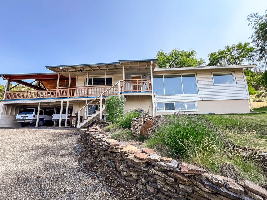 This four-bedroom, three-bathroom residence exemplifies pride of ownership both inside and out. Meticulously maintained, the home boasts a total of 3,090 square feet, including a daylight basement. The main level features both a living room and a family room, complemented by a well-appointed kitchen equipped with ample cabinetry and counter space. The abundance of large windows allows for an influx of natural light throughout the home.

An exceptional covered patio, adorned with a beautiful tongue-and-groove ceiling, provides an ideal setting for entertaining. The basement includes a versatile bonus room, a pantry, two storage/workrooms, and an additional bedroom with its own bathroom. Additionally, the property features a two-car carport and a spacious gravel area, offering ample parking for all your recreational vehicles and toys.