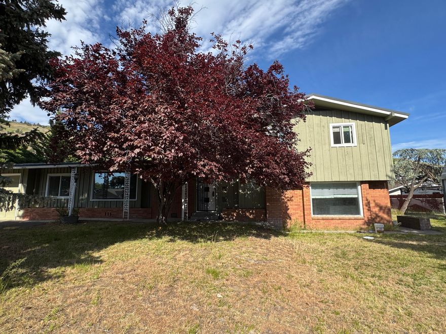 Fabulous Home with Versatile Living Spaces! Welcome to this spacious 3-bedroom, 2-bathroom home (possible 4th bedroom) nestled on over 1/3 acre in desirable Moyina neighborhood. Situated on a corner lot in a quiet, established area, this property offers a blend of privacy, functionality & convenience. Step inside to find 2 living spaces + dining area-perfect for relaxing or entertaining. The kitchen & main living areas flow seamlessly to the deck & backyard—ideal for enjoying your private outdoor space. The huge, fully fenced backyard offers plenty of room for gardening, play or peaceful evenings. A standout feature is the separate potential studio setup complete with its own kitchenette & bathroom, making it a perfect option for a home office, guest quarters or rental potential. Highlights include attached 1-car garage + detached 2-car garage, perfect for workshop/hobby space, & ample RV/toy parking. Don't miss your opportunity to own a flexible & functional property in a great area!