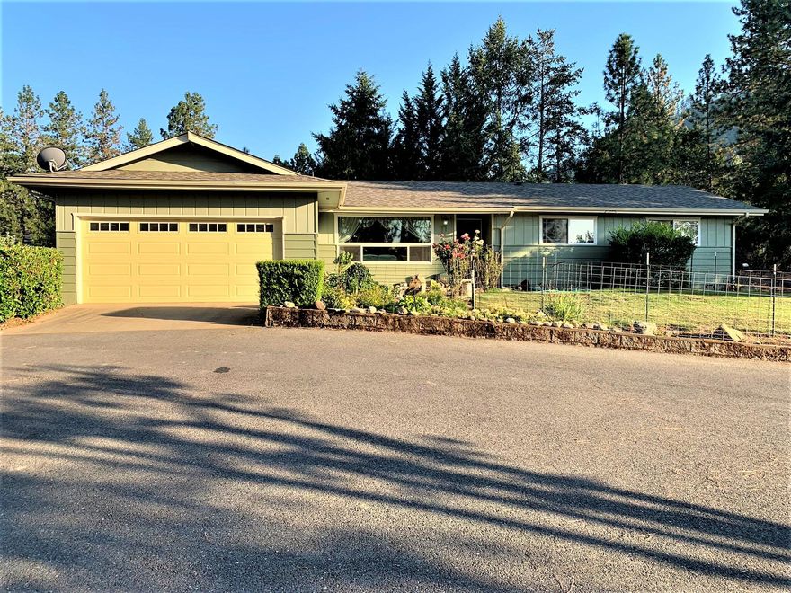 This cozy 3 bedroom and 2 bathroom home has a beautiful view of lush trees and pastures in the Jerome Prairie area. Separate living room and family room areas with sliding door leading to the gazebo-covered patio. 
The home is cleverly situated for backyard shade in the summer evenings. Well laid out and organized property is surrounded by mature shade trees, fruit trees on the side, a small pond, paved driveway, a koi pond in the front flower garden, a shed and a large fenced area large enough for a few of your favorite animals or a huge green area. There is a 2 car attached garage and a paved basketball area with a hoop at the end of the driveway. All this just outside of town. 
This home is perfect for a peaceful retreat or a family home ready to make memories in.