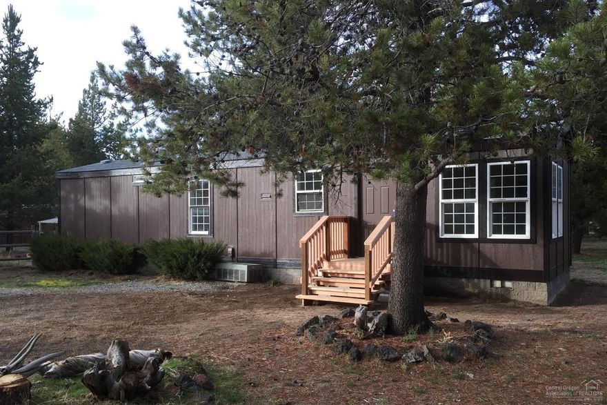 Quiet, private 2 Bdrm/1 Bath Updated Home on 1.82 flat, usable acres. Oversized detached 24x36 garage with 3 add'l rooms for office, hobbies, or shop. Level ground with well maintained stalls for your horses and farm animals. Includes many trees, perimeter fencing, some x-fencing, and additional storage building. Imagine the possibilities! Updates include new roof, new siding, paint, & flooring. Near acres of BLM Land. 2 Minutes to Hwy 97 - about 20 minutes to Bend. Bring your horses & your toys!