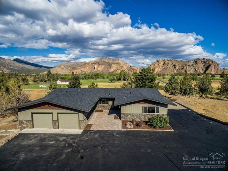VIEW-VIEW-VIEW! Smith Rocks just right out your door! Elevated location on 6 acres with 2 acres of irrigation. This home is in pristine condition and boasts a layout that is perfect for entertaining both indoors and out. Spacious floor plan and full of natural light! Open kitchen with custom cabinetry, stainless steel appliances and tile work, family room and a living room with a handsome rock wall and fireplace surround. You must see this home!!!