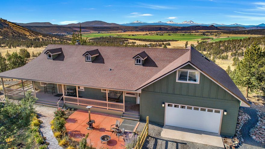 Peaceful Setting & Cascade Mountain views serve as the backdrop for this 2468 SF Custom Home on 162 ac. Lots of updates that kept comfort, style and efficiency top of mind. A newer woodstove, heat pump water heater & recent solar system make this a very energy efficient home. Hardwood, stone tops & an island cooktop. If you are seeking privacy & serenity, & being self-sufficient appeals to you, then the rolling hills, the springs that attract wildlife, the greenhouses & a large garden with water from a separate well will help you find what you are looking for. For hunting there are options to choose from. LOP tags if available or apply for private unit tags. Hike, horseback or ATV the land here is easy to experience. Wind among the trees past rock outcroppings & around springs to end up on a hilltop with views of mountains & sunsets that invite you to stay after dark to experience untold numbers of stars. There's also a large heated & insulated shop & covered RV parking w/hookup.