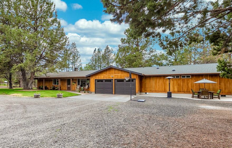 Rare, West Tumalo, extensively remodeled, single-level home! This immaculate home includes vaulted ceilings, exposed beams, updated kitchen & bathrooms. Home ALSO features a recent addition with a separate lavish master suite (2 master suites total). The new space could also be used for a bonus/family room or mother-in-law quarters if desired. This fully fenced small acreage includes irrigation rights & equipment, detached shop or 2nd garage and animal stalls & pasture. All this is less than 2 miles from Tumalo State park, Deschutes River, the Bite & downtown Tumalo. Only 5 miles to Shevlin Park or 8 miles to downtown Bend! New cedar & Breckenridge siding, new paint & stain, newer roof, flooring, lighting & kitchen... really everything has been updated! Also recent water heater, heat pump & drain field. Come visit this quaint Tumalo farm today! Peek-a-boo Mtn views