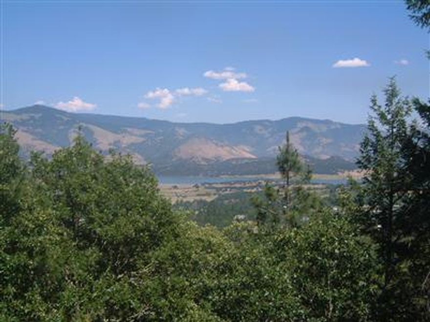 40 acres on Timberlake Drive consisting of 7 separate tax lots. Rare opportunity to acquire 7 tax lots with development potential; multiple homesites possible; breathtaking views out over Emigrant Lake and valley/hills beyond; timber coverage on moderate to steep slopes; within 3 miles of Ashland city limits on mostly paved public roads; graded private road through property w/access to all 7 lots; municipal electric within 1,000 feet. Serious, qualified inquires only. Interested parties to conduct their own investigation as to suitability for development.