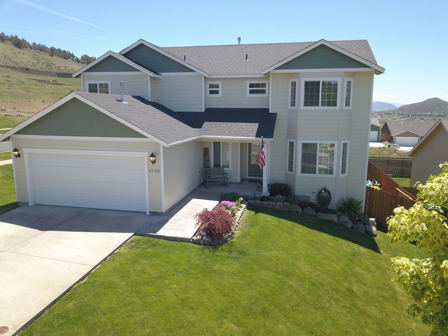 Beautiful home on corner lot with detached shop in Southview.  This develoment is nestled against a wooded hillside conveniently located between pristine mountain lakes, schools, hospital & shopping.  Panoramic view including Mt Shasta.  Landscaped, fenced backyard is adjacent to paved easement which is convenient for walking or biking.  Home showcases natural materials including oak flooring, granite and wood banister.  5th bedroom is being used as a main level home office.  Stainless kitchen appliances, formal dining, formal living room & family room with gas fireplace.  Floor plan features 4 spacious bedrooms upstairs & 2 linen closets.  Water & sewer system for Southview is privately owned.  Homeowner's association dues of $48/month covers street lights, maintenance of common areas & street snow removal.  196 sq. ft. heated & insulated shop has garage door & man door entry.  Don't miss the massive crawlspace storage on west of home at the door.  South facing covered porch.