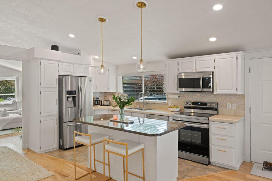 Discover modern elegance and comfort in this unique 3-bedroom, under $550K home, featuring exquisite custom chandeliers in each bedroom and integrated LED lighting throughout. Revel in updated cabinetry, state-of-the-art appliances (2025), and a captivating dining area with a solar tube (2023) for ample natural sunlight. Enjoy outdoor relaxation with a full private deck, fenced yard, and soothing Marquis hot tub. The interior boasts beautiful hickory wood flooring, a home gym complete with an iFit treadmill, and three impressive electric fireplaces for cozy evenings. A new laundry room countertop further enhances functionality. Unwind in custom-designed bathrooms and guest bedrooms, all with new window screens and refreshed exterior paint.
Located in a peaceful, friendly neighborhood, this gem offers quiet, community-focused living with kind neighbors and structured, fair HOA. The perfect blend of charm and modern convenience awaits your arrival in this stand-alone haven. A Must See!