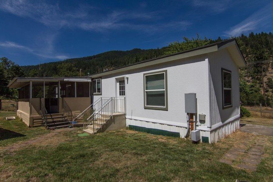 Wonderful country property in the beautiful Applegate River Valley near Applegate Lake with access to the Applegate River. The property consists of 2 separate tax lots. The 5.02 acres features a 2011, 2 bedroom, 1 bath manufactured home, a workshop, and a separate barn/storage building. There is also a large garden area, fruit trees, expansive lawn and a great well (per owner). Another separate 5.01 acres, adjacent to the main parcel, is included. Enjoy the peaceful privacy of the 10 acres or develop the second parcel for a two-family setup. This property also includes a 1/13 interest in a small recreational lot on the Applegate River with river access. Discover this special property today!