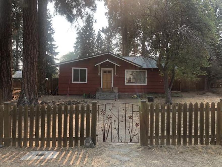 Located in Northwest Bend near shops, schools, parks & downtown. This property includes 2 corner lot's totaling .25 acres. The home was built in 1952 - 1 story, 1266 sf, 2 bedrooms, 1 bath, detached 308 sf car garage. Flat lot's with development potential. Alley access & extra on site parking. A lovely setting surrounded by mature ponderosa trees in an older established Bend neighborhood. Rare opportunity! Please respect Tenant's privacy.