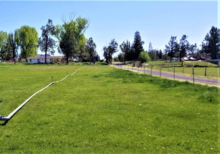 Irrigated Acreage in Terrebonne!!! Very close to town, this property has so much to offer!! incredible mountain views from this single level generous sized ranch home on over 5 acres! 4 bedrooms, living room and bonus room. Huge kitchen with NEW hickory cabinets and New granite counter tops, formal dining room! Property is private, pasture is separated from house so animals are not on your huge deck! Lots of room for kids to play here! Irrigation is COI. 4.17 acres of water AND a private well!! Adorable storage building with carport! Updated septic system too! This is a must see!!!! Sellers are packed up and can close very quick!