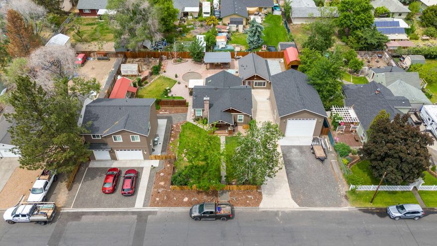 Downtown Redmond one of a kind jewel R5 income property. The owner resides in the main house, a 1940 bungalow, 2bd/2 ba. 1200 SF. All new paint, wainscoting, rounded archways, gas FP insert, chef kitchen, quartz counters,  SS appl. gas range, updated bath.  A second dwelling is a 936 SF 2bd/1ba 2 story/3 car garage free standing home built in 2023, by HiLine. A 700+/- 1 bd/1ba ADU all updated. An auxillary building 1 bd/1ba 200 SF. A 960 SF RV/boat shop. The lndscpng is in place w/ mature trees, shrubs and flowers. Enjoy morning & evening sitting spots. An elabrate outdoor could be kitchen structure/ BBQ area. The greenhouse & garden area w/ rm for chickens. RV full hookup, elec, sewer, H20. All fenced/gated. Could be a family compound, adult foster care, however currently AirBnB's & full time rental. Walking distance to dwntwn Redmond, resaurants, breweries, and wine bars. Homestead & Canyon trail near by. OMC. Sale is ''AS IS'' New Roof in 03/24. 
The owner pride shows throughout.