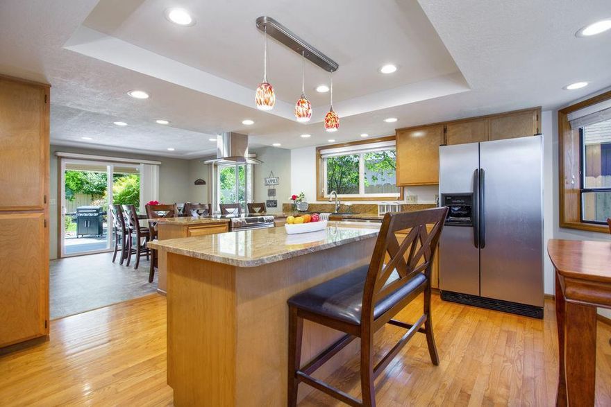 Impeccably maintained, single-level, 1880SF, 3BR/2BA home located on a quiet street. This home has an open, efficient, layout featuring large windows offering ample natural light, new LED can lighting throughout, hardwood flooring & brand-new carpeting. As you enter the home, you'll find a welcoming entryway, living room w/large windows looking out onto the private back-yard, a large, updated kitchen w/direct access to the dining room which has doors out onto the covered patio area. The master suite offers a walk-in closet & ensuite bath. Following along the hallway you'll find 2 additional bedrooms & large guest bath w/double vanity + laundry room w/direct access to a large, finished 2-car garage. Outside you'll find a low maintenance, irrigated yard w/mature trees & bushes including plum, dogwood, magnolias & lilacs. During the Spring months, you'll love the tulips & Spring blossoms. Raised garden beds for veggies, a tiled patio area, irrigation system & more! Welcome home!