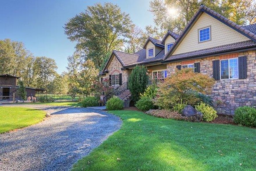 Gorgeous Rogue River front estate features a magnificent 3247 Sq.ft. 4 bed 2.5 bath home custom blt in 2002, updated & remolded in 2015. Features include a great room w/stone fireplace, formal dining room, spacious master suite w/fireplace, private access to deck & patio, well appointed kitchen w/granite counters, gorgeous wood cabinets, high end appliances, eating bar, & large pantry. Large windows to take in the picturesque setting. Detached 4-car garage/shop w/2 bed 1 bath apartment upstairs. Peace & tranquility abounds this beautiful riverfront 6.80 acres w/850' of frontage, level green & lush w/large expansive deck & Patio over looking the river w/gardens and 3 sources of water irrigation (per seller: well, river & irrigation District) Decorative pond w/water feature, great for entertaining. Patio w/stairs down to the rivers edge. Pasture w/6-stall barn, for animals. Fenced/cross fenced. All information is deemed reliable but not verified, buyer to do their own due diligence