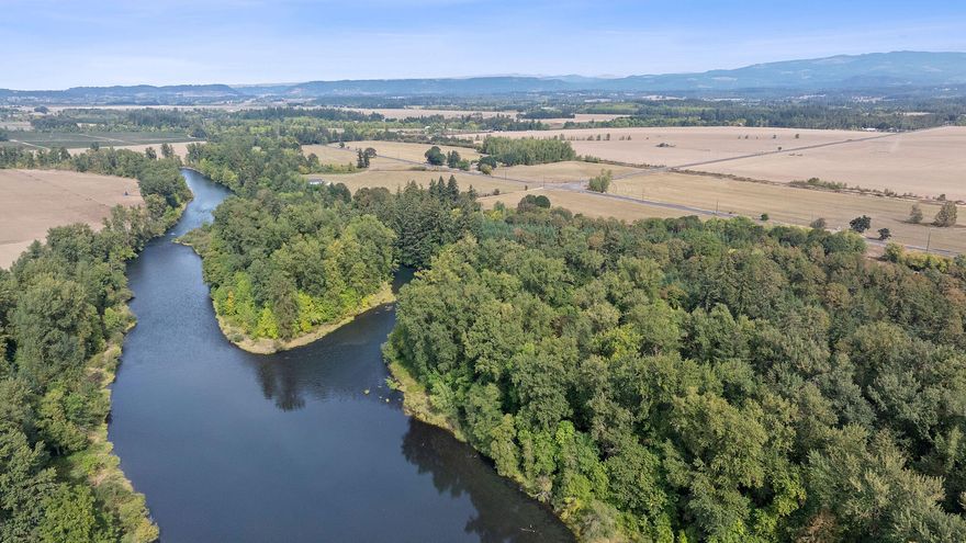 South Santiam Riverfront is a stunning 90± acre property featuring scenic riverfront. Just six minutes from downtown Lebanon, this location combines rural charm with access to city amenities, including restaurants, shopping, healthcare, and entertainment. Nestled along the South Santiam River, it's an ideal spot for fishing enthusiasts, offering opportunities to catch steelhead, salmon, and trout, all while enjoying a private, tree-lined setting with about a 1/2 mile of riverfront.

Located in the fertile Willamette Valley, the land has been used for dryland farming, having produced grass seed in the past. This property is perfect for recreation, fishing, wildlife viewing, and farming, making it an excellent retreat for those seeking solitude or a small farming venture.