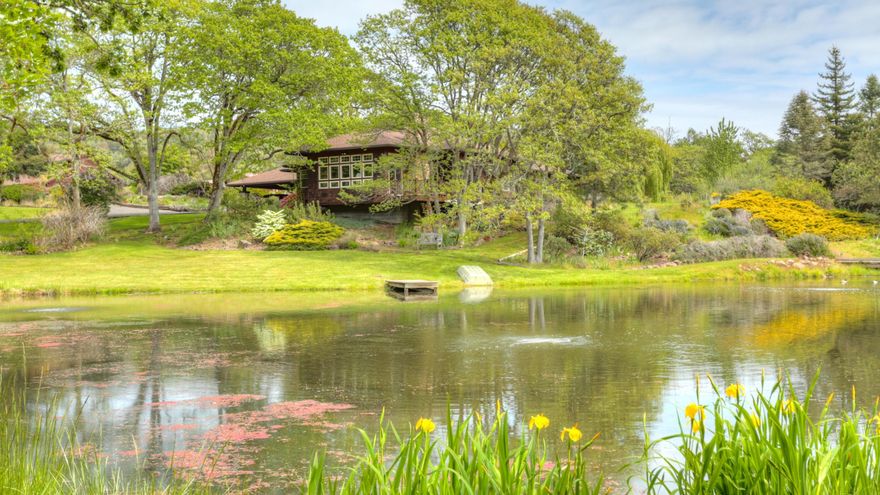 Private picturesque ranch property nestled against the hills w/rolling pastures, oak woodlands, perennial gardens & winding gated drive on over 80 acres w/55 irrigated. Custom northwest-style single level home, open & spacious w/9ft ceilings, lots of natural wood & extensive built-ins, this home offers views from every window. Great room plan including vaulted open beam pine ceilings, rock fireplace, formal dining & breakfast nook. The center island cook's kitchen features Travertine & tile counters, sub-zero refrigerator, Signature 6-burner gas range & walk-in pantry. Light & bright incl. formal living room w/gas fireplace, wide plank Oak floors, entertainment center & spacious master suite w/jetted tub, dbl vanity & walk-in closet. In-home office, 3rd bdrm/art studio, dual HVAC systems, separate 1512sf log home (ideal caretakers residence), 3-stall barn w/hay loft, 4-car garage, portico, shop, greenhouse, backup generator and two year-round ponds that enhance this incredible setting